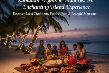 A Maldivian family sharing a traditional Iftar meal on a sandy beach under palm trees decorated with fairy lights at sunset.