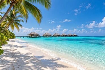 Maldives in winter with a white sand beach, turquoise lagoon and overwater villas